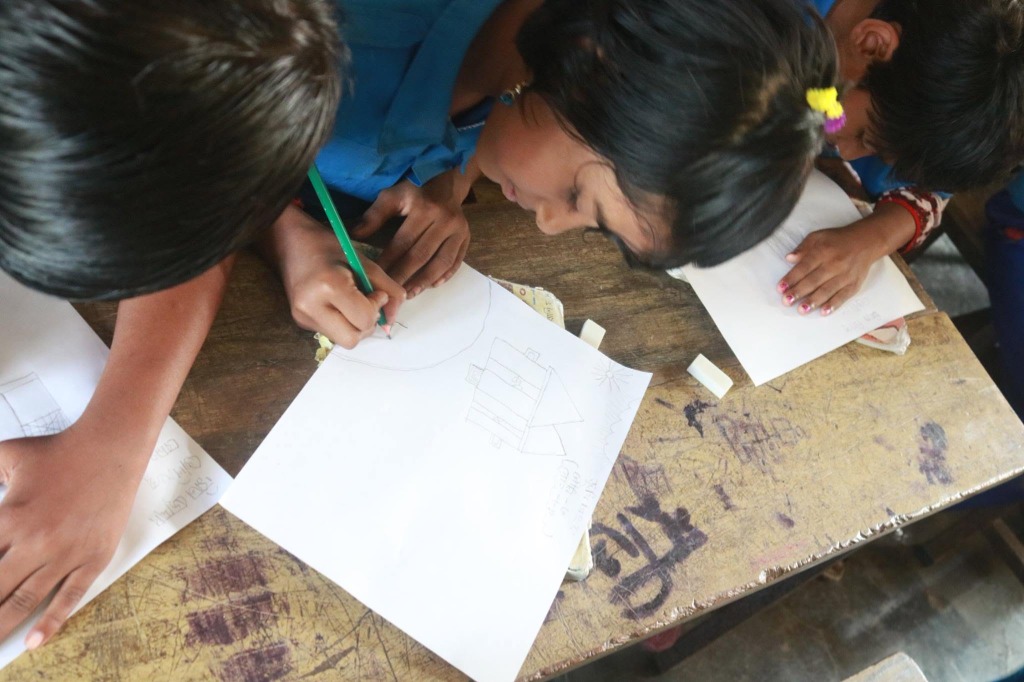 Students Writing in Notebooks
